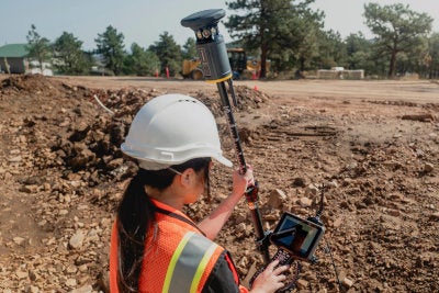 employee swaps from GNSS to optical using a tablet